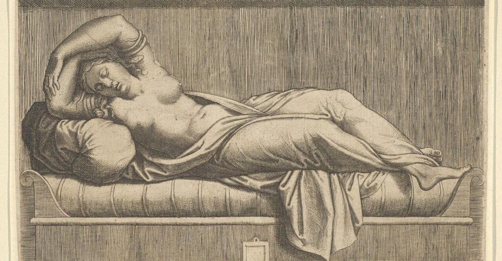 Stencil work of Cleopatra lying on her side on a bed topless