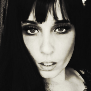 Small thumbnail for Mistress V blog. Her black and white profile image - full face.
